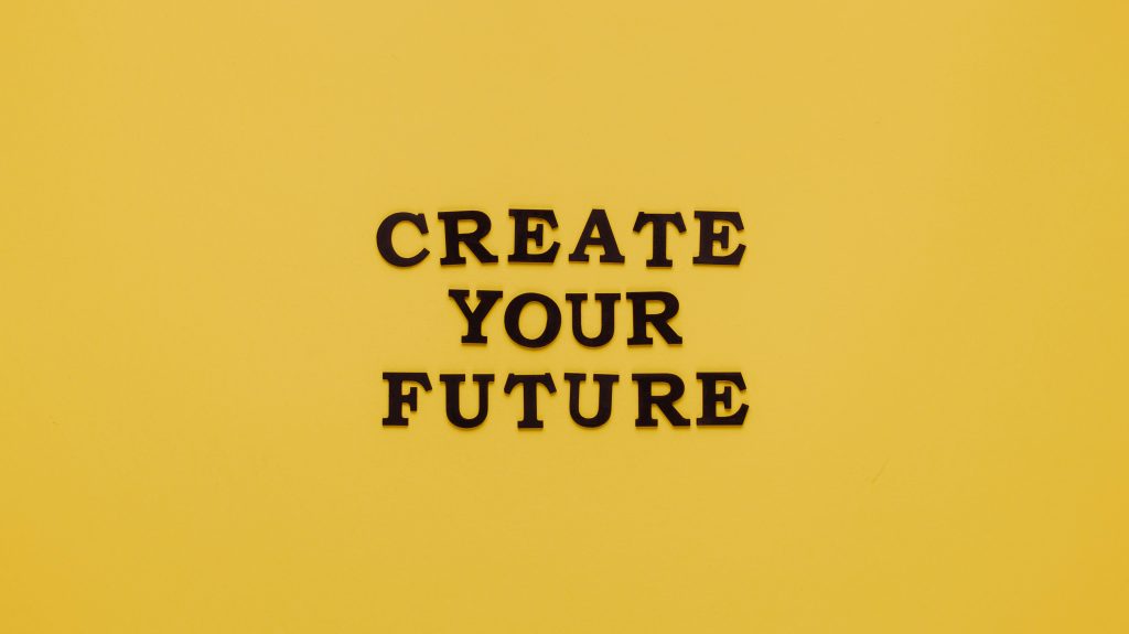 Black text on a yellow background that says, "Create Your Future".